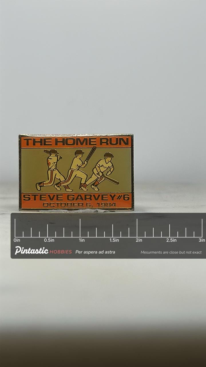 Steve Garvey Baseball Pin: Orange Gold Enamel - 1984 Sports Accessory with ruler overlay for size reference