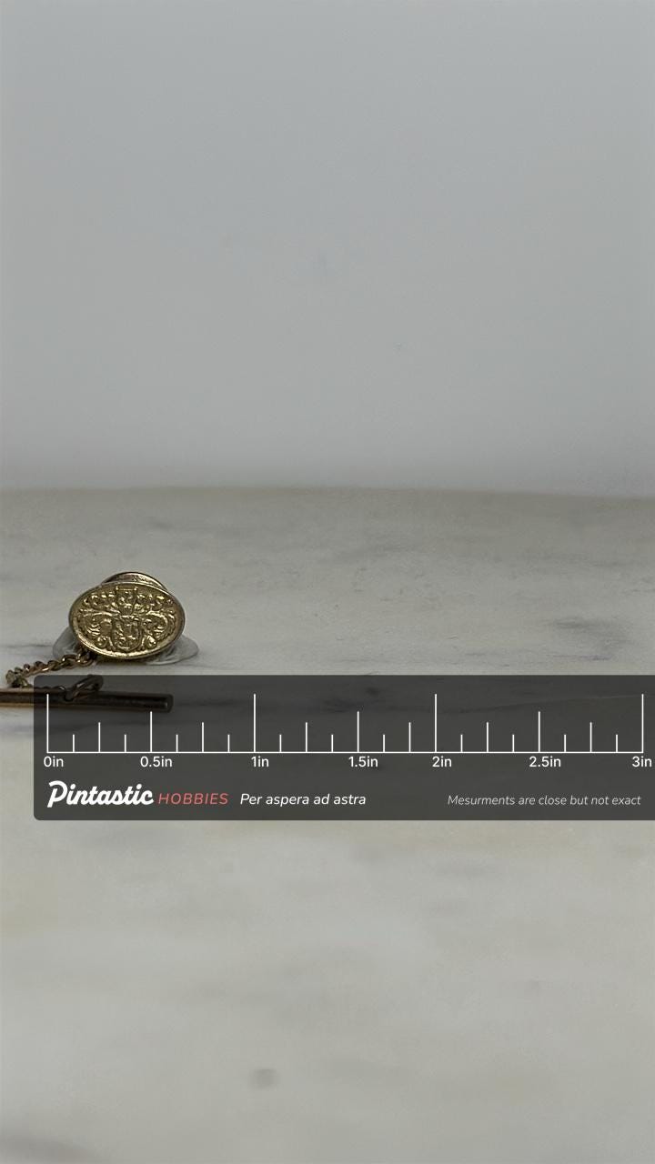 Heraldic Crest Tie Tack Pin: Gold Tone Oval - Vintage Gentleman Accessory with ruler overlay for size reference