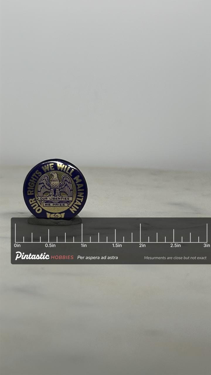 Iowa State Motto Enamel Pin: Gold & Navy Round - Patriotic Vintage Accessory with ruler overlay for size reference