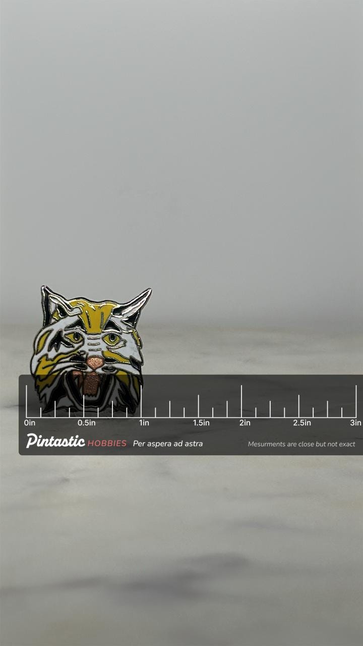 Wildcat Head Enamel Pin: Yellow & Black Finish - Retro Animal Accessory with ruler overlay for size reference