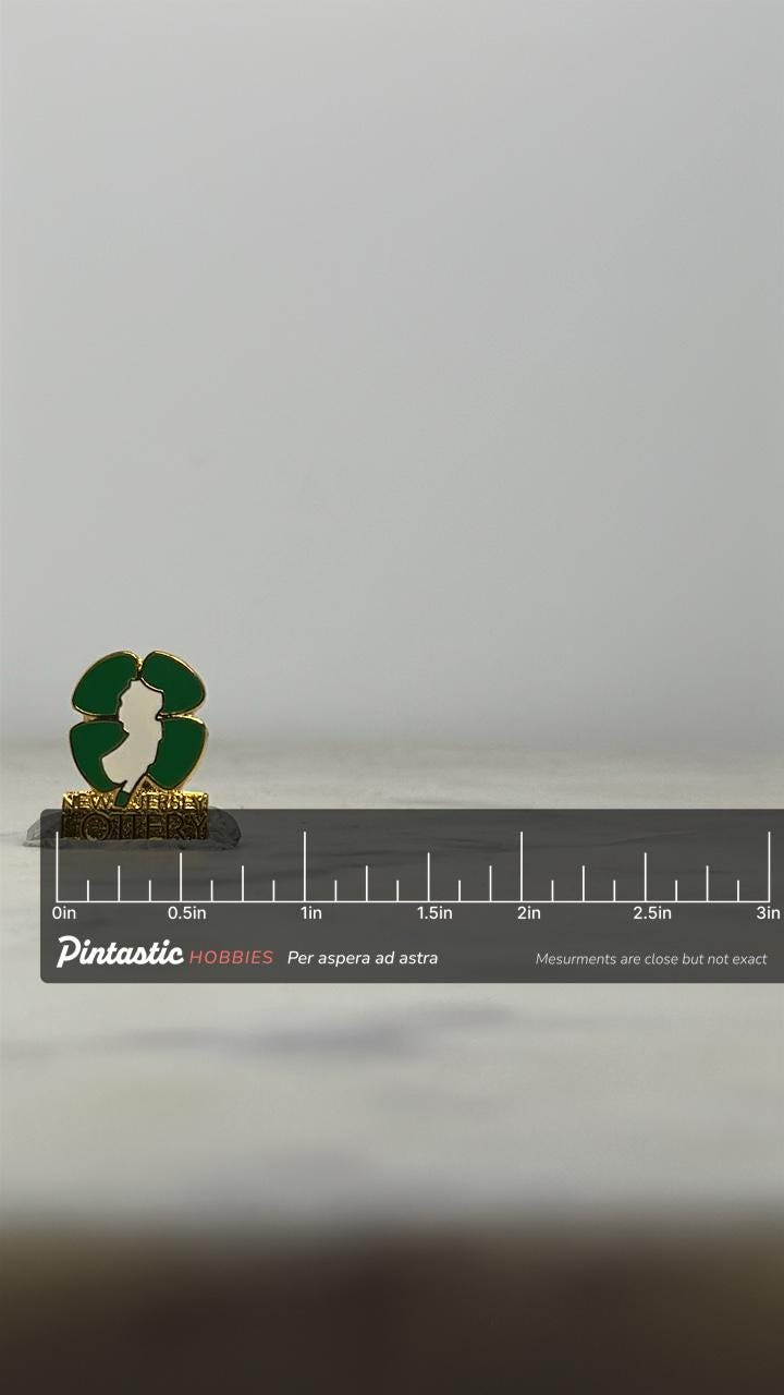 New Jersey Lottery Enamel Pin: Green & Gold Finish - Vintage Collector Accessory with ruler overlay for size reference