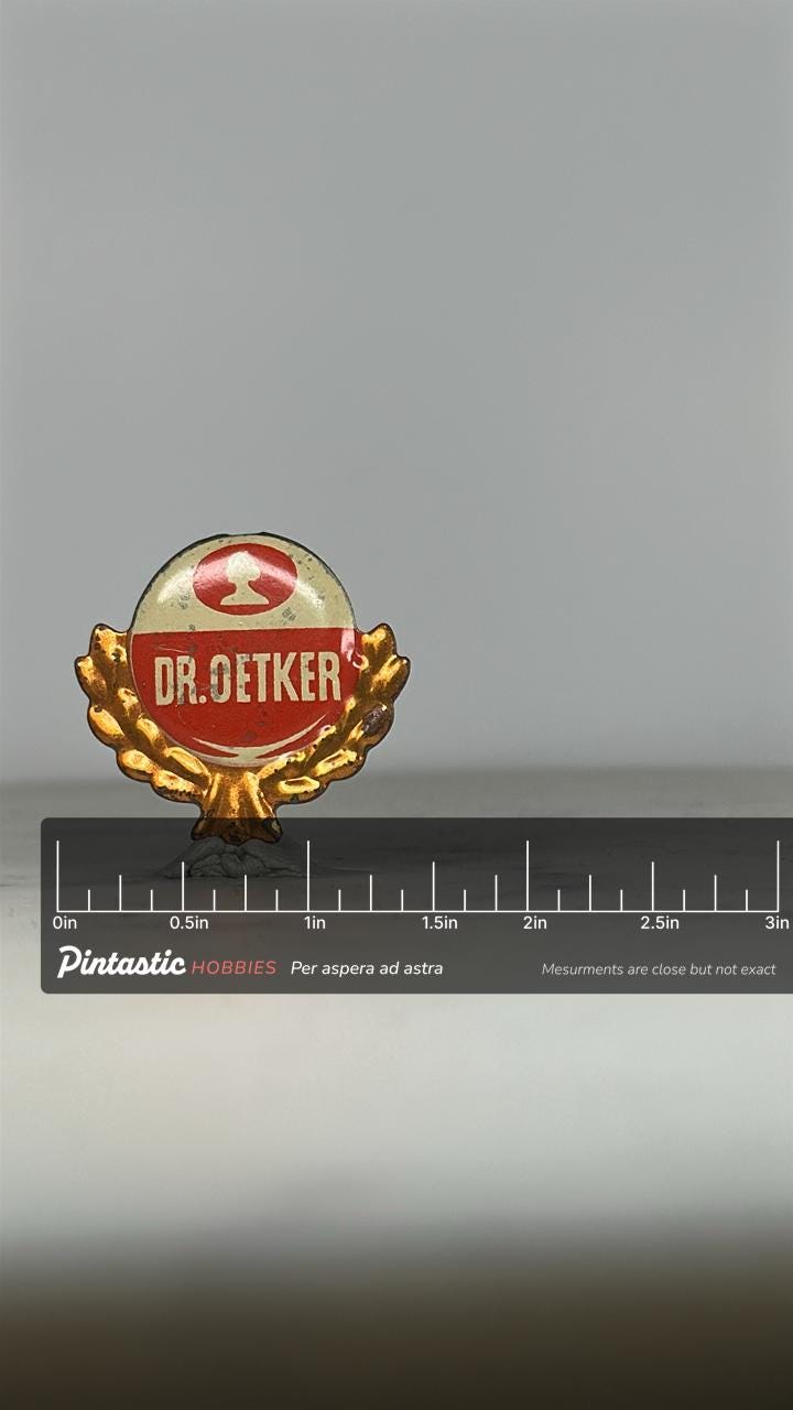 Dr. Oetker Enamel Pin: Red & Gold Logo Design - Vintage Advertising Accessory with ruler overlay for size reference