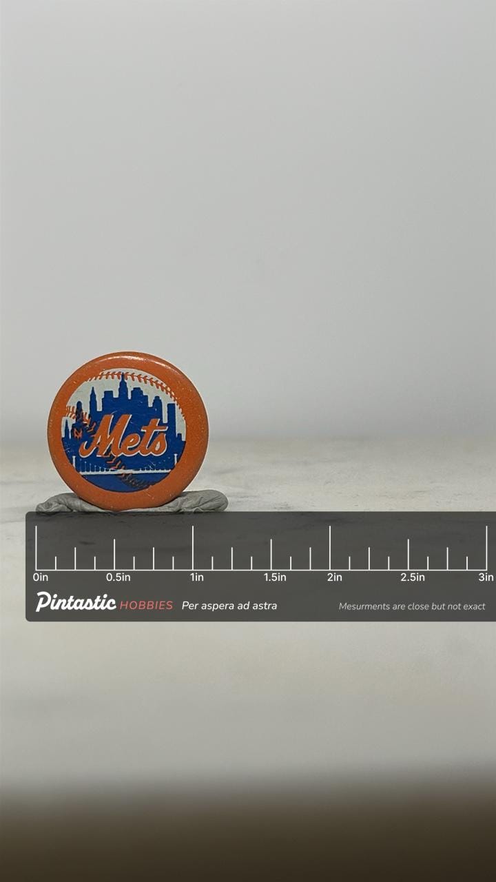 New York Mets Baseball Pin: Orange Blue Round - Vintage Sports Accessory with ruler overlay for size reference
