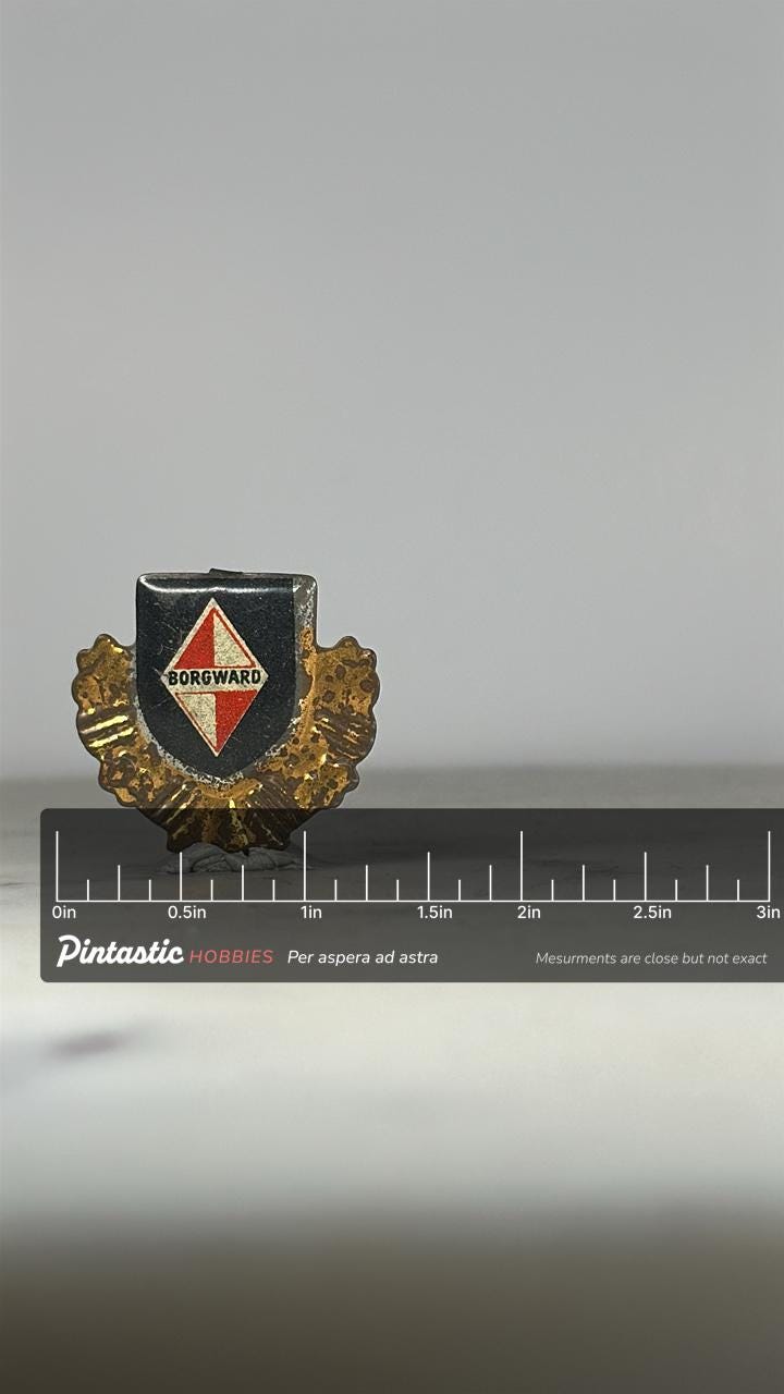 Borgward Car Emblem Pin: Red Black Gold Crest - Vintage Auto Accessory with ruler overlay for size reference
