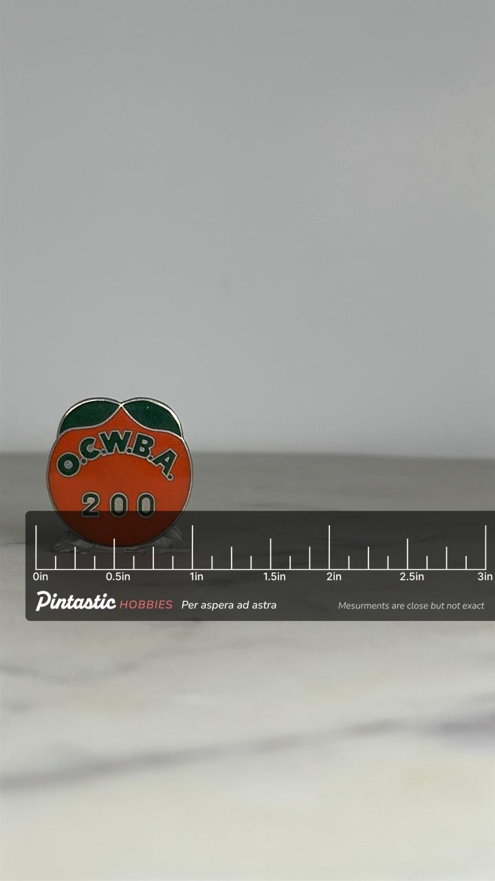 OCWBA 200 Membership Pin: Orange Enamel - Retro Organization Accessory with ruler overlay for size reference