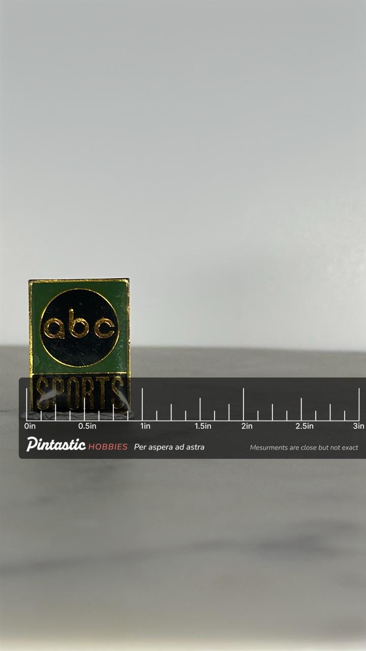ABC Sports Enamel Pin: Black Gold Green - Vintage TV Accessory with ruler overlay for size reference