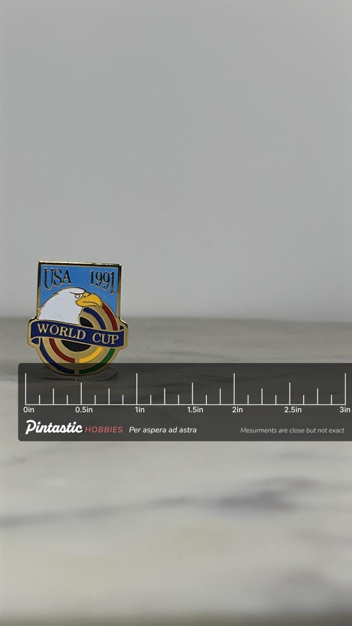 USA 1991 World Cup Pin: Gold Enamel Eagle - Vintage Sport Accessory with ruler overlay for size reference