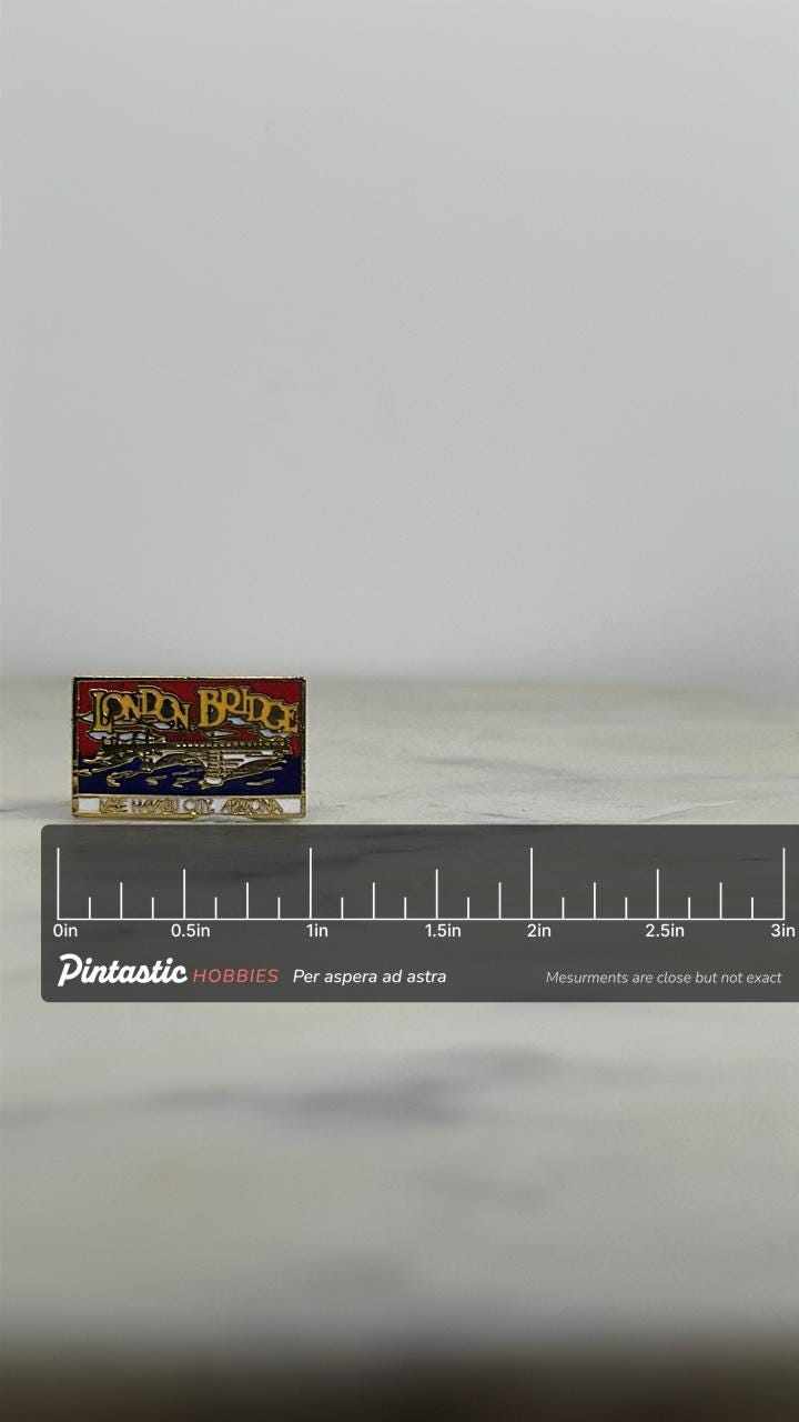 London Bridge Souvenir Pin: Red/Blue Enamel Finish - Vintage Travel Accessory with ruler overlay for size reference
