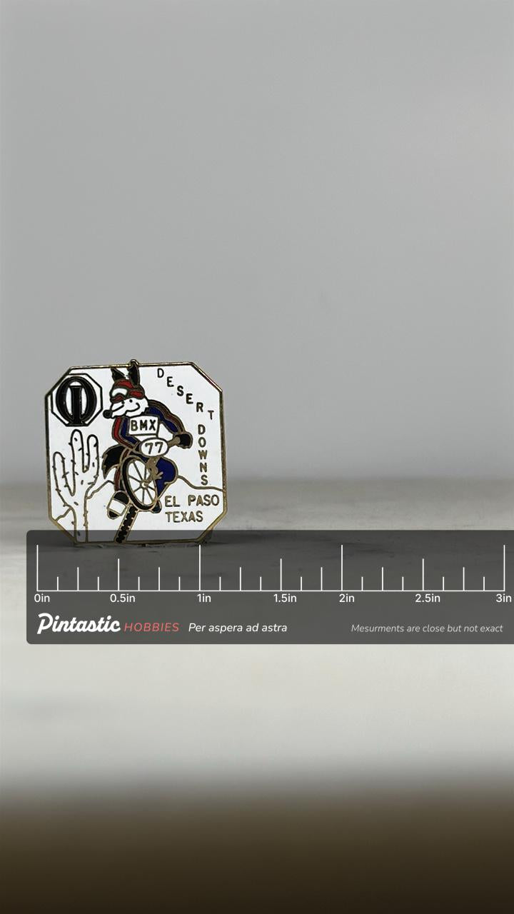 Desert Downs BMX Pin: White Enamel - 1977 El Paso Texas Accessory with ruler overlay for size reference