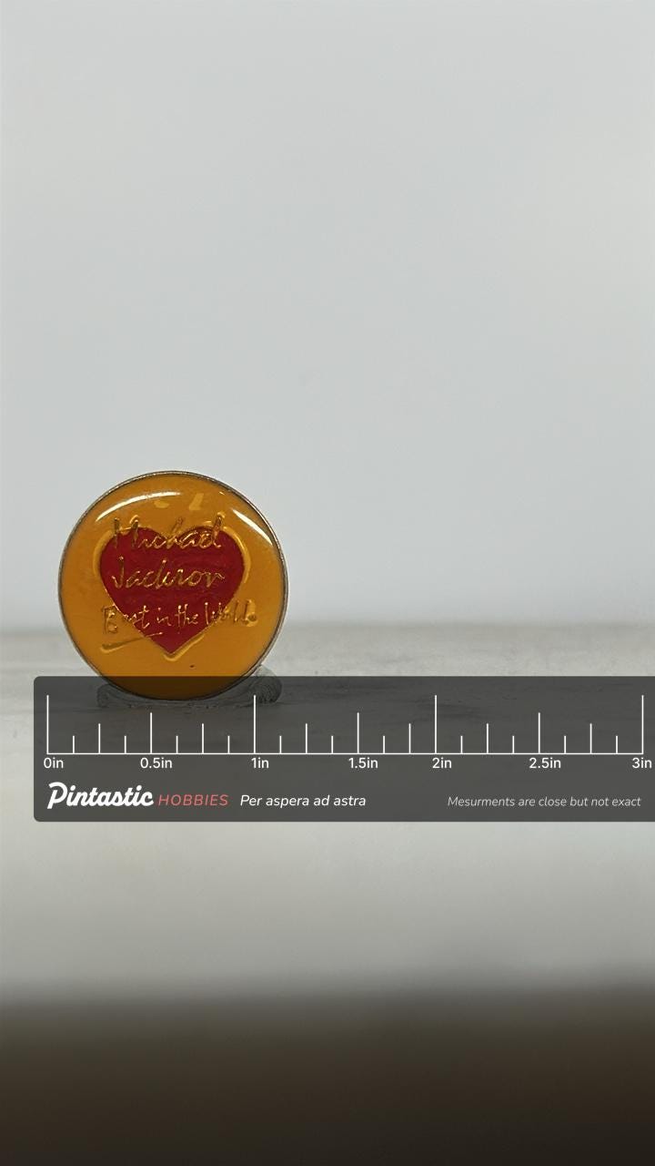 Michael Jackson Enamel Pin: Red Heart on Yellow - 1980s Fan Accessory with ruler overlay for size reference