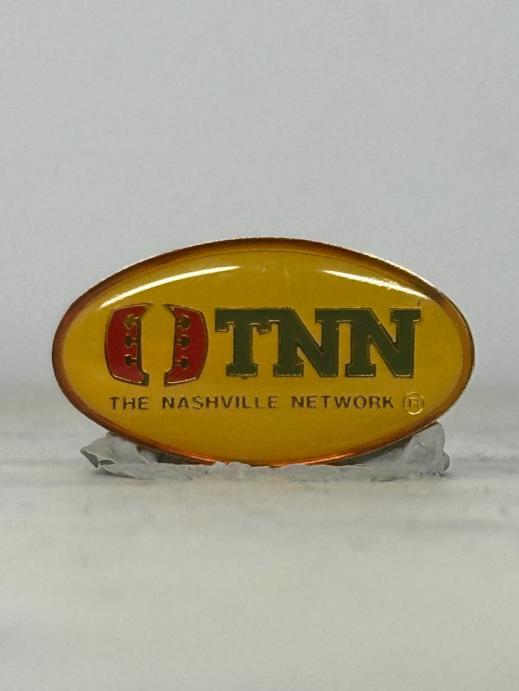 TNN Enamel Pin: Yellow Oval Logo - Vintage TV Accessory