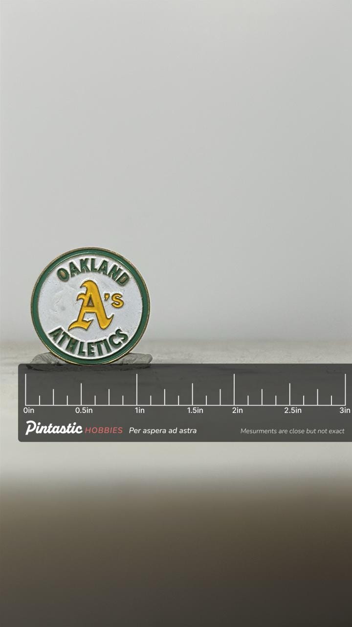 Oakland A's Baseball Pin: Green & Yellow Enamel - Vintage Sports Accessory with ruler overlay for size reference