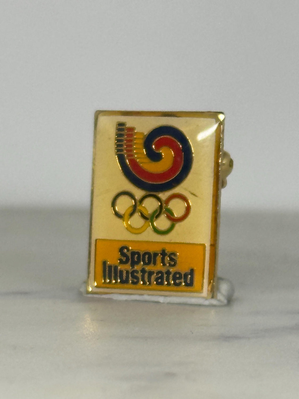 Sports Illustrated Olympic Pin: Gold Enamel Finish - 1980s Media Accessory