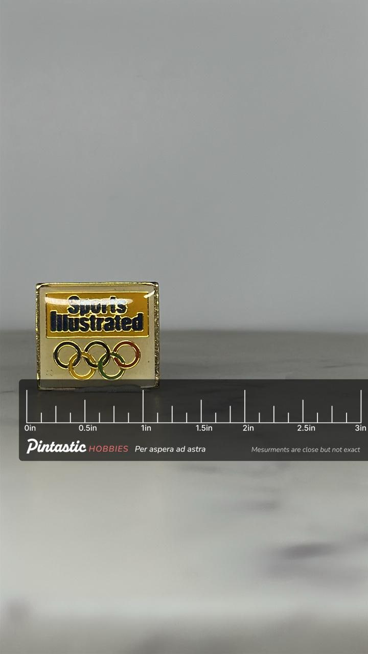 Sports Illustrated Olympic Pin: Gold Enamel Finish - Vintage Sports Accessory with ruler overlay for size reference