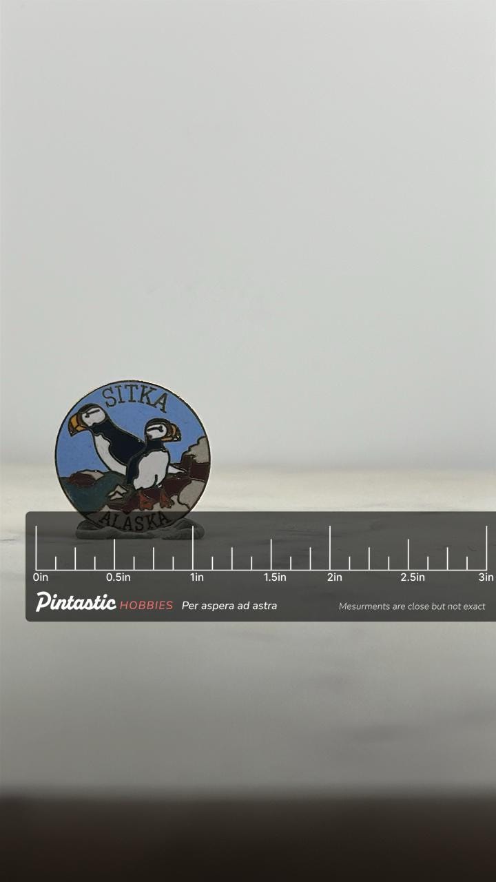 Sitka Alaska Puffins Enamel Pin: Round Goldtone - Souvenir Travel Accessory with ruler overlay for size reference