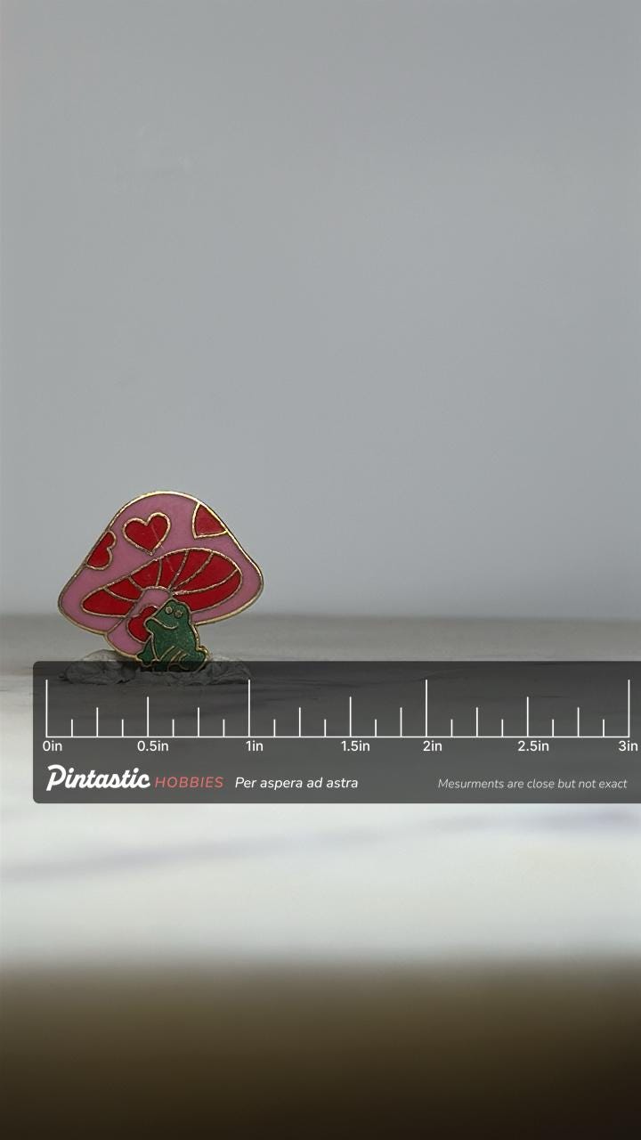 Frog & Mushroom Enamel Pin: Pink Red Gold Finish - Whimsical Retro Accessory with ruler overlay for size reference