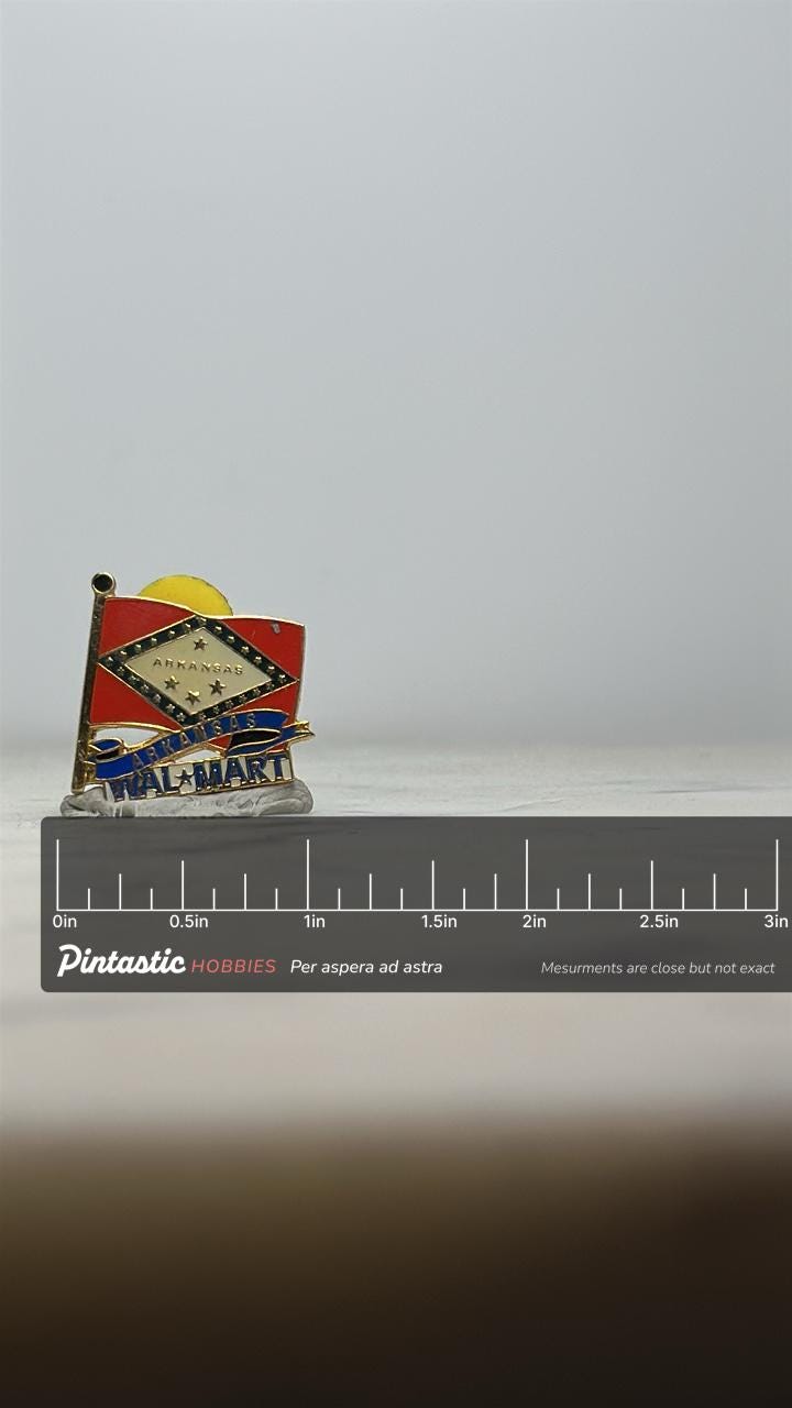 Arkansas Wal-Mart Pin: Red Enamel & Gold Trim - Vintage Collectible Accessory with ruler overlay for size reference