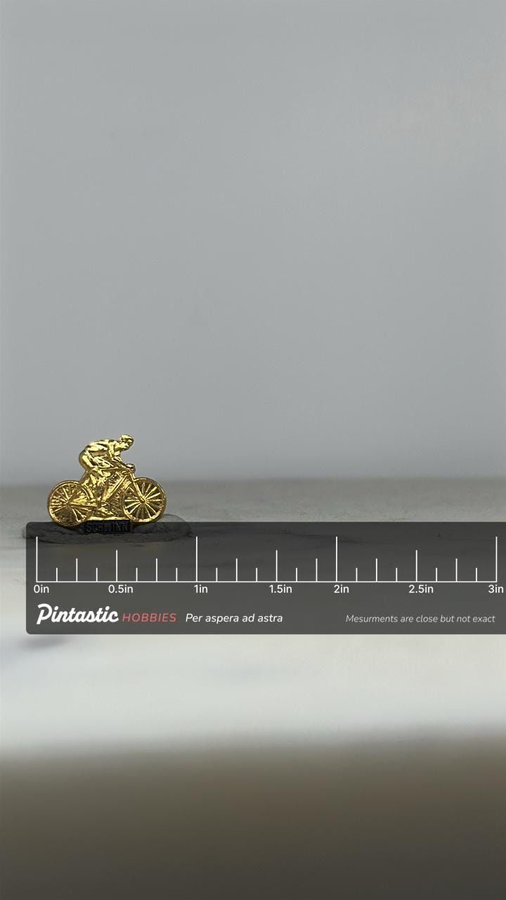 Schwinn Bicycle Rider Pin: Gold Tone Finish - Vintage Sports Accessory with ruler overlay for size reference