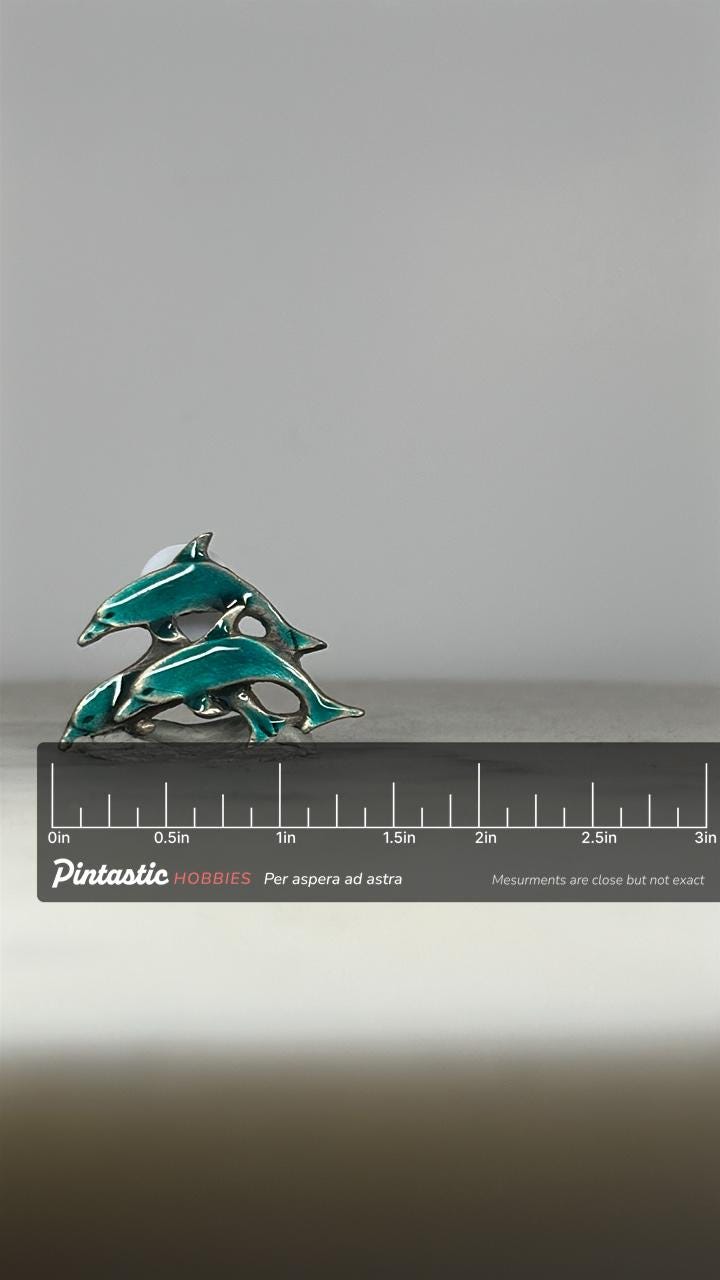 Dolphin Trio Enamel Pin: Teal Silver Tone - Vintage Ocean Accessory with ruler overlay for size reference