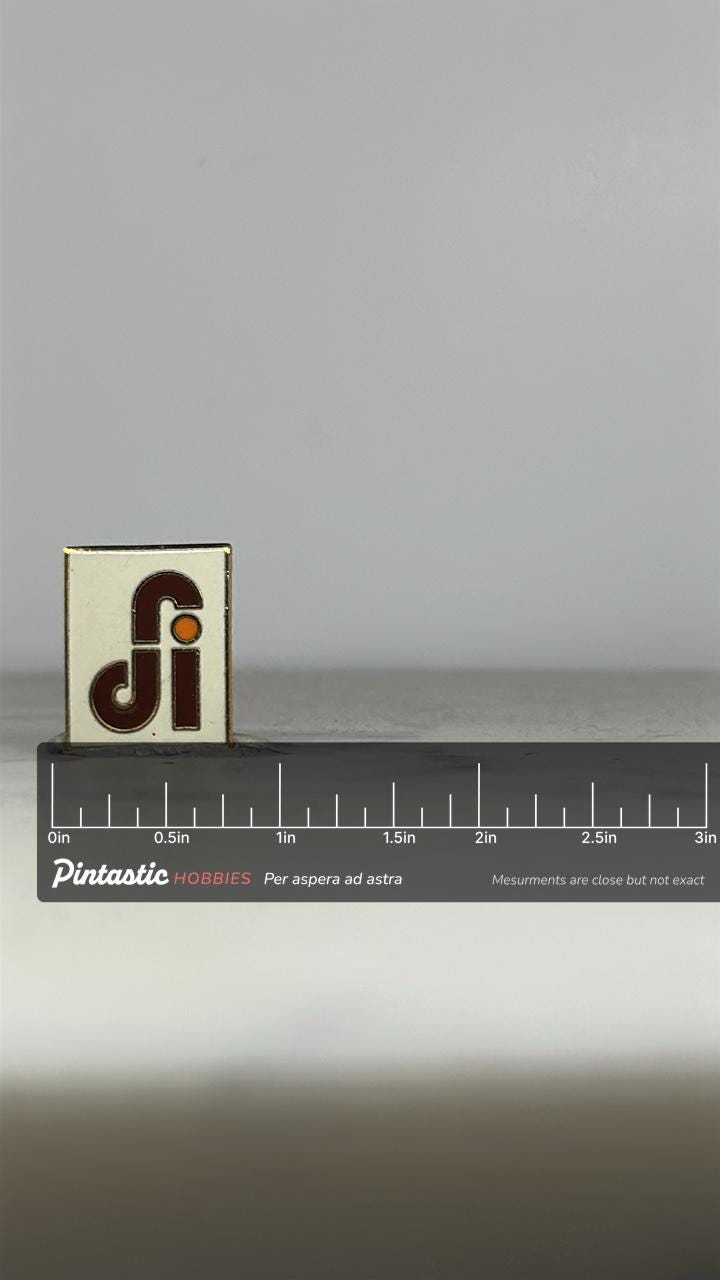 DFI Logo Enamel Pin: Red & Orange on White - Retro Company Accessory with ruler overlay for size reference