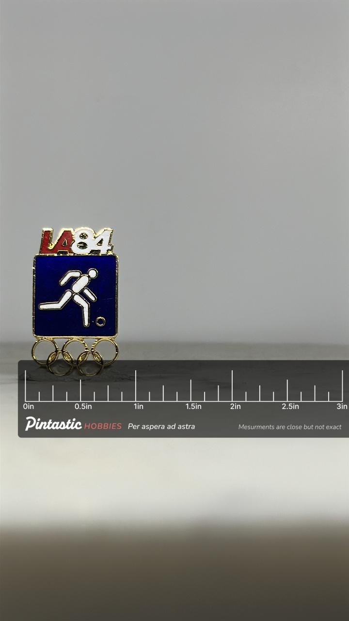 LA 1984 Olympic Soccer Pin: Enamel Gold Finish - Vintage Sports Accessory with ruler overlay for size reference