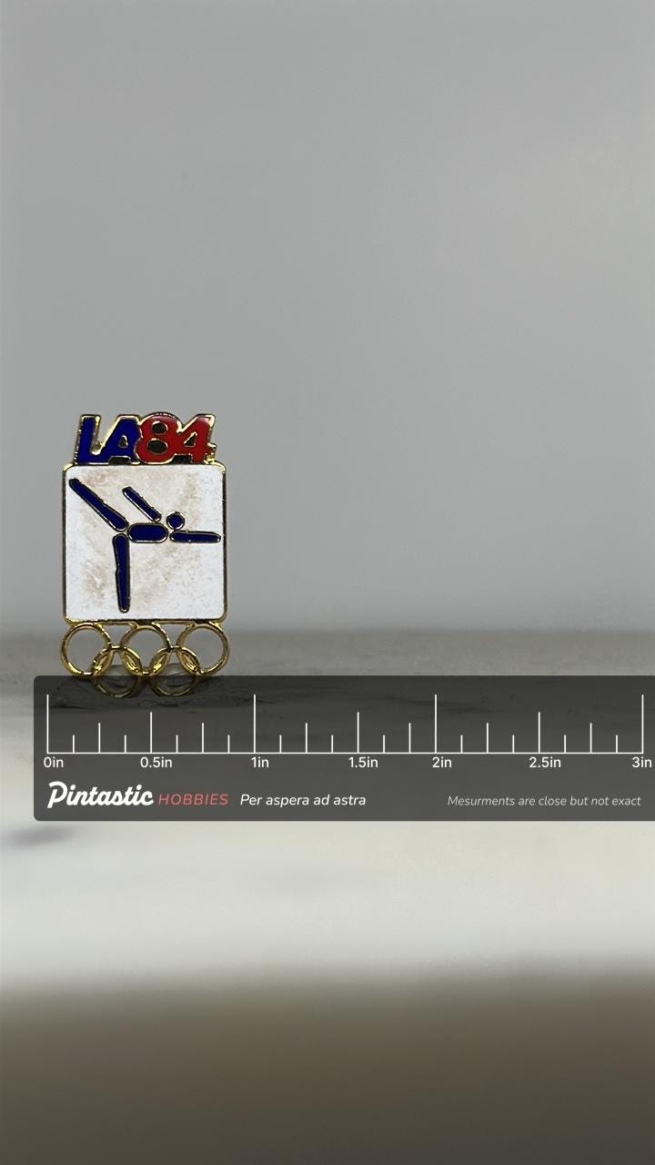 LA 1984 Olympic Gymnastics Pin: Red Blue Gold Enamel - Vintage Sports Accessory with ruler overlay for size reference