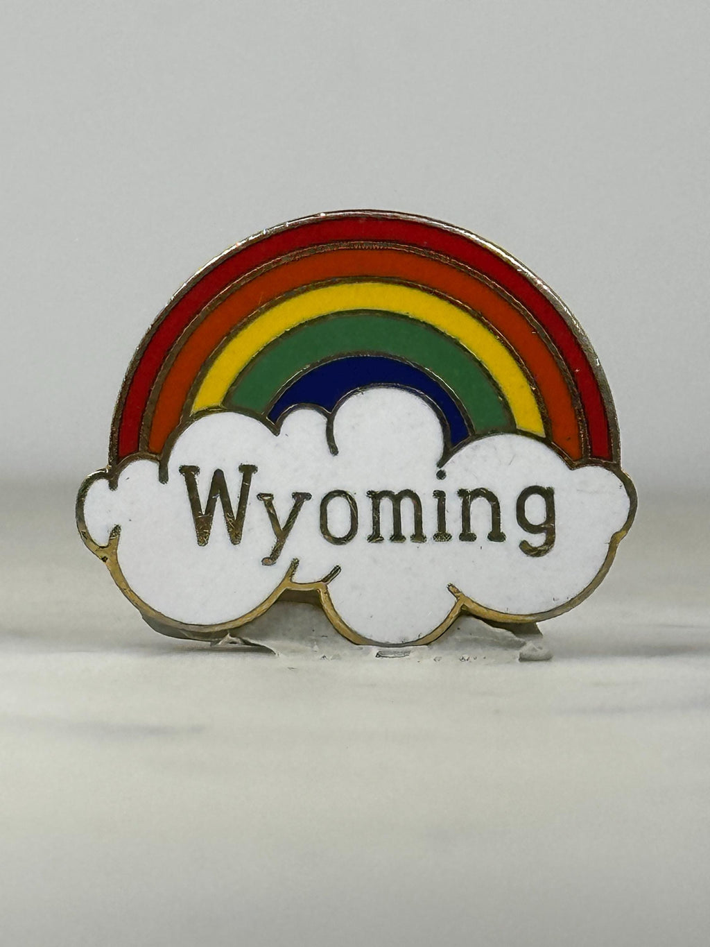 Wyoming Souvenir Pin: Rainbow Enamel - Retro Travel Accessory