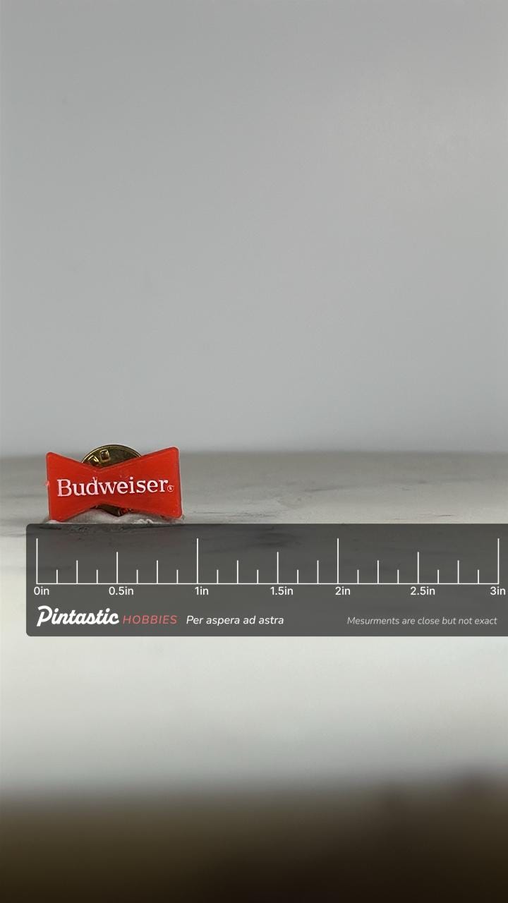 Budweiser Logo Pin: Red Enamel Gold-Tone - Vintage Barware Accessory with ruler overlay for size reference