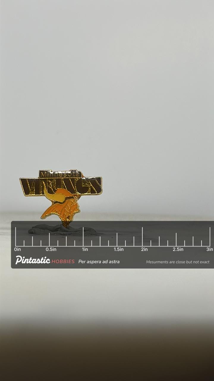 Minnesota Vikings Enamel Pin: Gold & Black Finish - Vintage NFL Accessory with ruler overlay for size reference