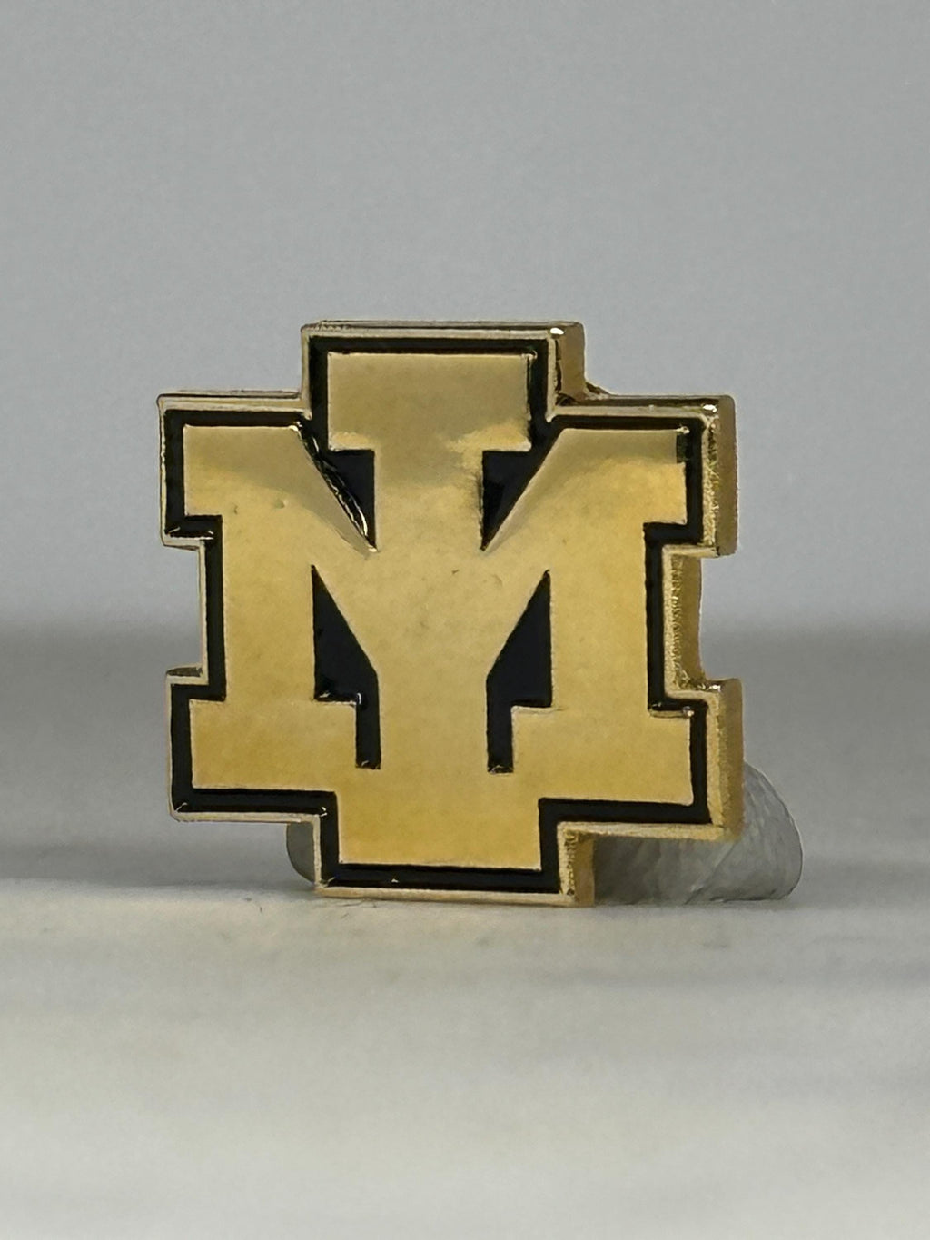 Vintage Iron Mountain Public Schools – Gold and Black Varsity Lapel Pin