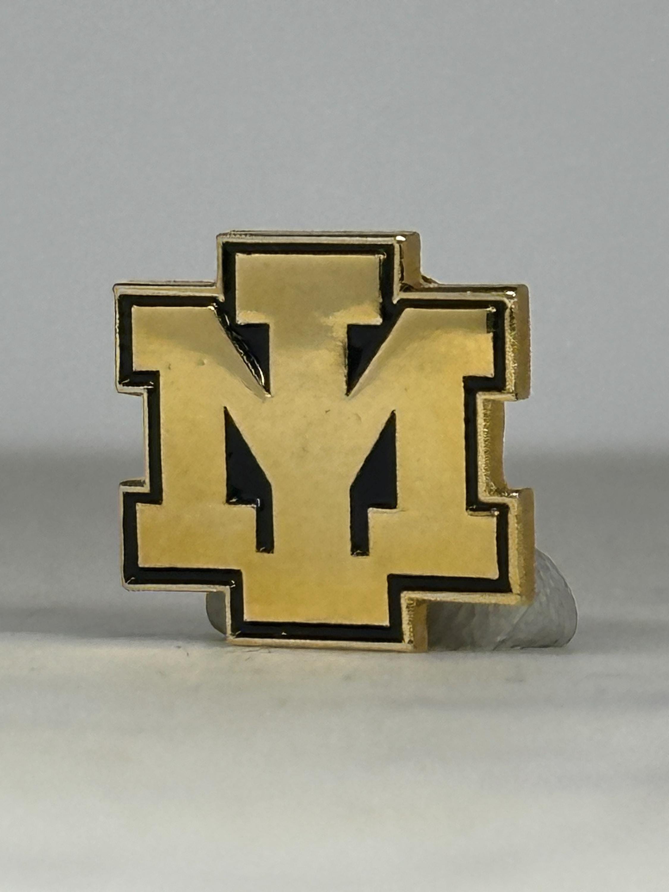 Vintage Iron Mountain Public Schools – Gold and Black Varsity Lapel Pin