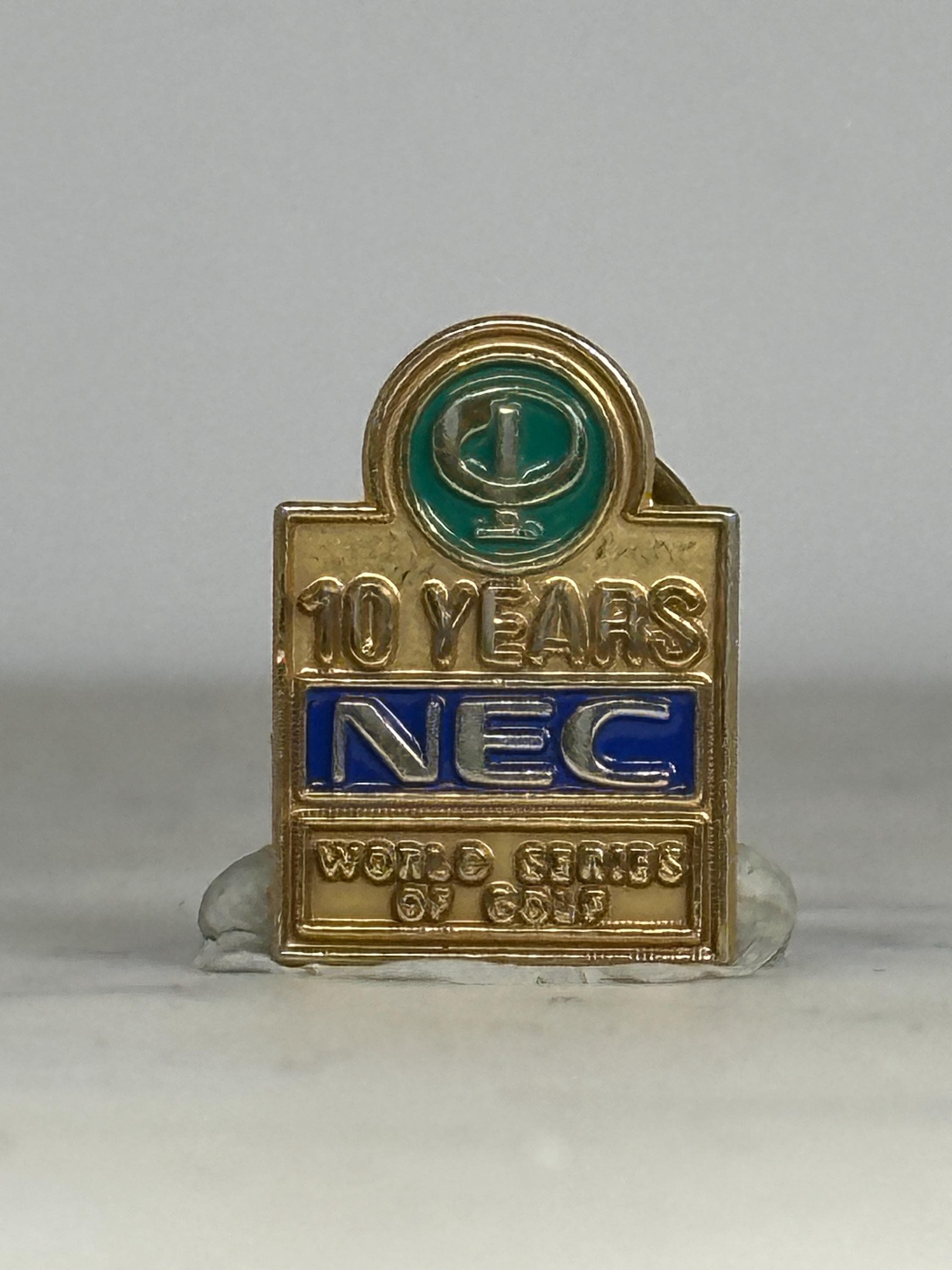 NEC Golf Enamel Pin: Gold Blue Green Finish - 10 Year Commemorative Accessory