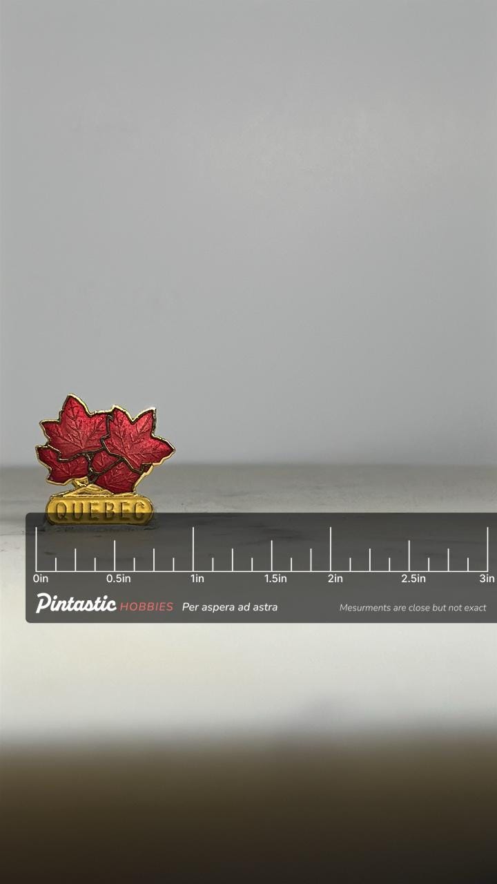 Quebec Souvenir Pin: Red Maple Leaf Gold Enamel - Vintage Travel Accessory with ruler overlay for size reference