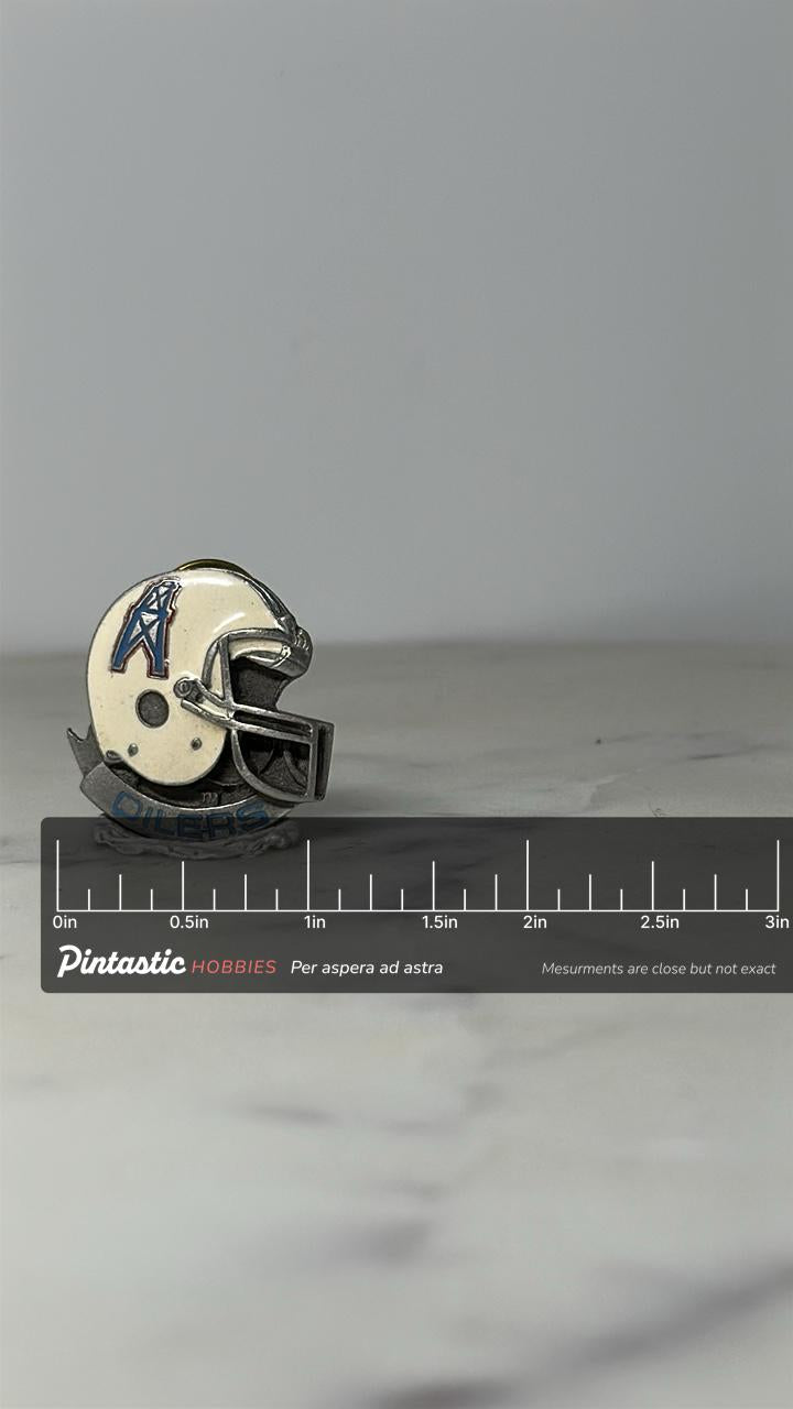 Houston Oilers Helmet Pin: White Enamel Metal - Vintage NFL Accessory with ruler overlay for size reference