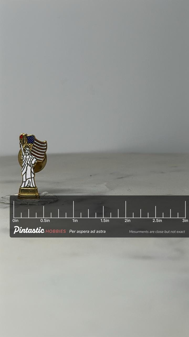 Statue of Liberty Lapel Pin: Gold White Enamel - Patriotic Accessory with ruler overlay for size reference