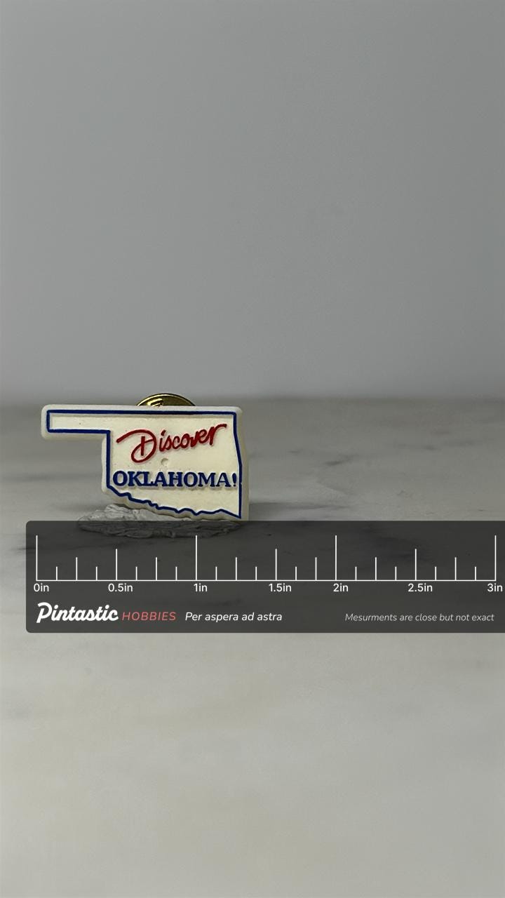 Discover Oklahoma Pin: White & Blue State Shape - Vintage Travel Accessory with ruler overlay for size reference