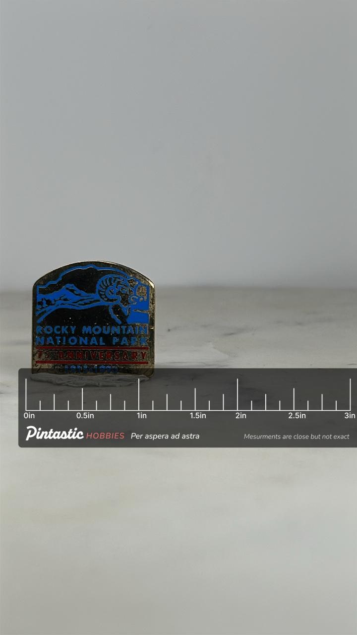 Rocky Mountain National Park Pin: Gold Tone Enamel - 1990 Anniversary Accessory with ruler overlay for size reference