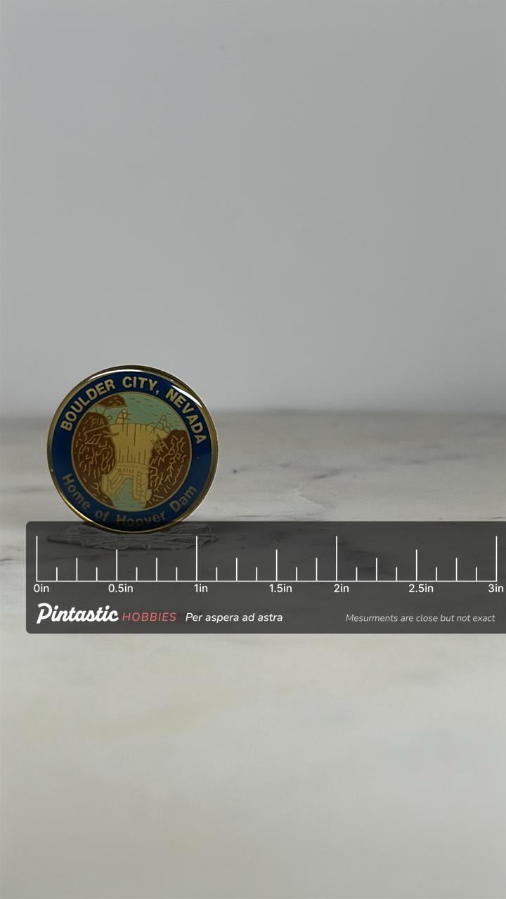 Boulder City Nevada Souvenir Pin: Gold Enamel Finish - Vintage Travel Accessory with ruler overlay for size reference