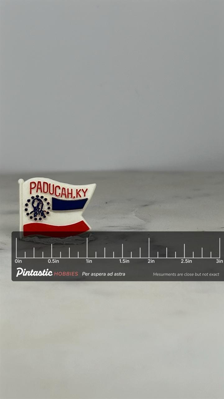 Paducah KY Flag Pin: Red White Blue Enamel - Vintage Souvenir Accessory with ruler overlay for size reference