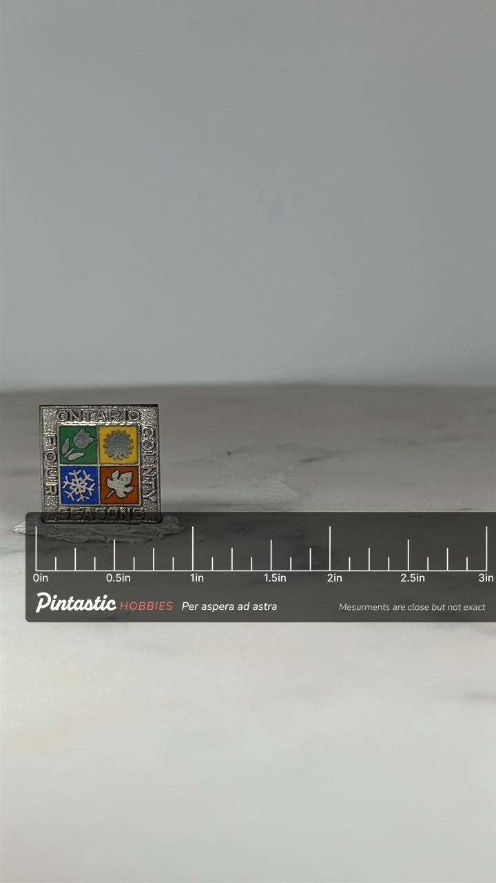 Ontario County Four Seasons Pin: Silver Enamel Square - Vintage Travel Accessory with ruler overlay for size reference