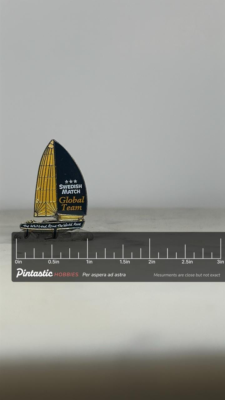 Swedish Match Sailboat Pin: Yellow Black Enamel - Racing Team Accessory with ruler overlay for size reference