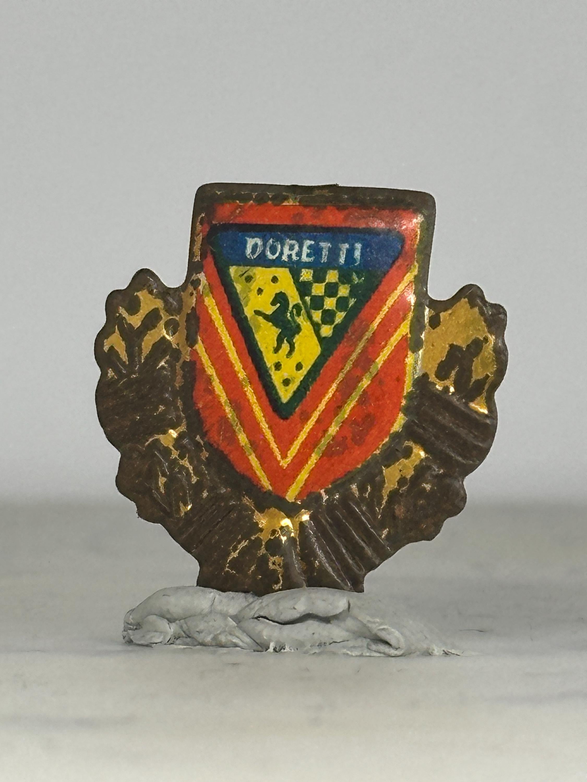 Doretti Car Emblem Pin: Red Gold Enamel Crest - Vintage Auto Accessory
