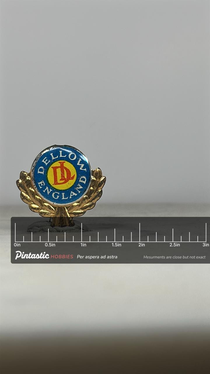 Dellow England Car Emblem Pin: Blue/Gold Enamel - Vintage Auto Accessory with ruler overlay for size reference