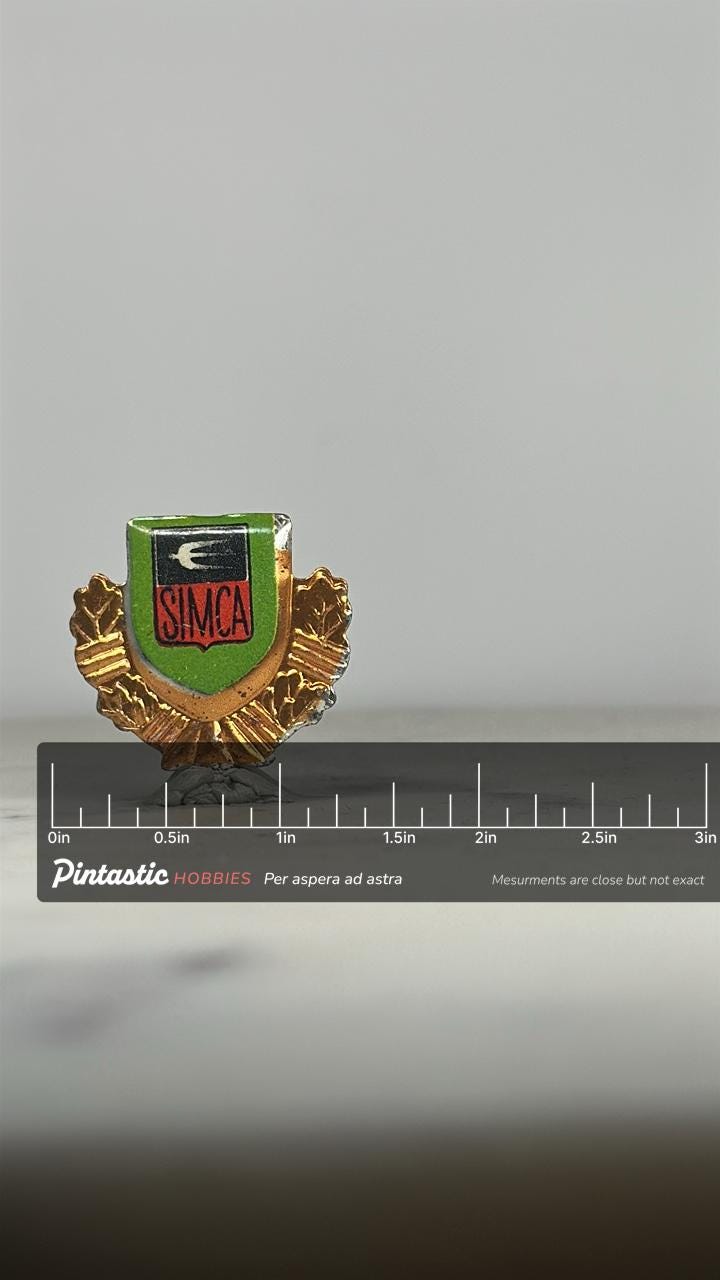 SIMCA Car Emblem Pin: Gold & Green Enamel - Vintage Auto Accessory with ruler overlay for size reference