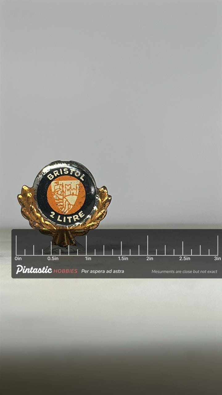 Bristol 2 Litre Car Pin: Black & Gold Enamel - Vintage Auto Accessory with ruler overlay for size reference