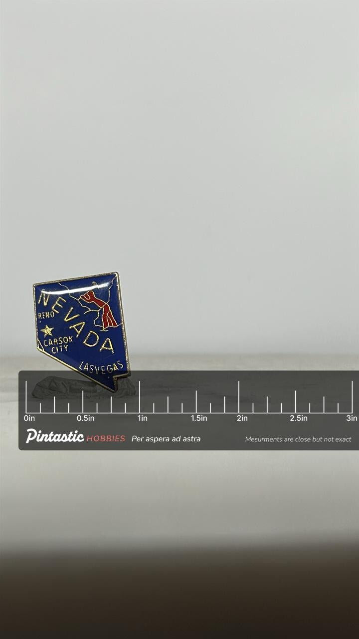 Nevada State Souvenir Pin: Blue Enamel Map Shape - Vintage Travel Accessory with ruler overlay for size reference