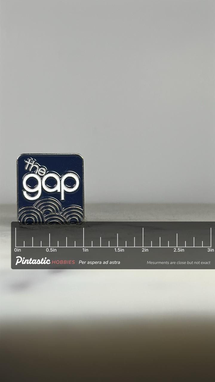 The Gap Logo Pin: Navy Enamel & Silver - Retro Brand Accessory with ruler overlay for size reference