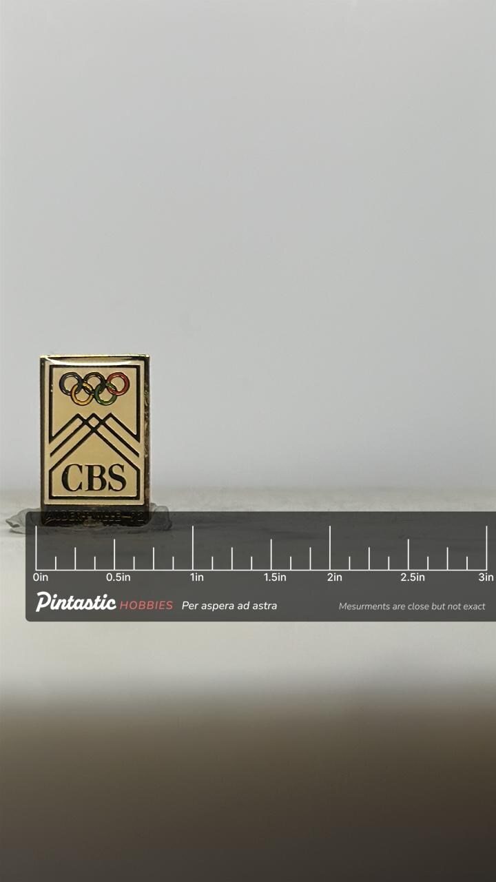 CBS Olympic Enamel Pin: Gold Tone Rectangle - 1992 Albertville Accessory with ruler overlay for size reference