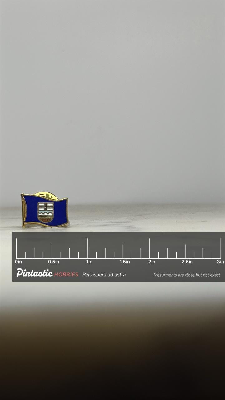 Alberta Flag Enamel Pin: Blue & Gold Finish - Vintage Travel Accessory with ruler overlay for size reference