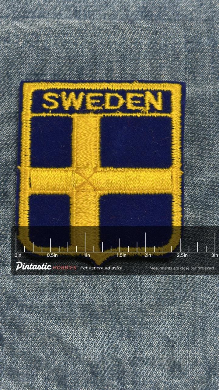 Sweden Flag Iron On Patch: Blue and Yellow Embroidered - Vintage Travel Accessory with ruler overlay for size reference